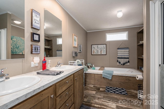 980 Lakeland Ave, Lincolnton, NC 28092 - bathroom with a bath, ornamental molding, a sink, and a textured ceiling