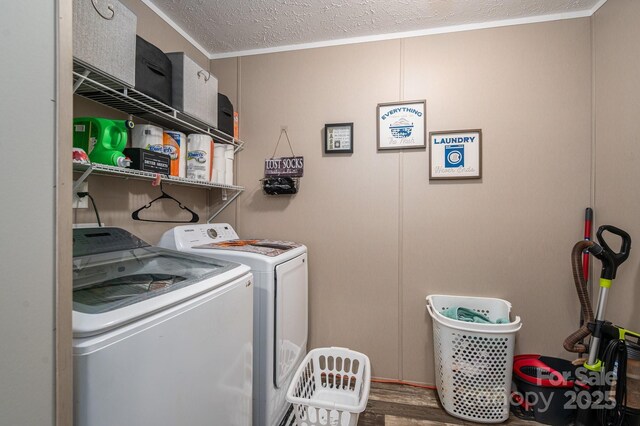 980 Lakeland Ave, Lincolnton, NC 28092 - washroom with ornamental molding, a textured ceiling, washer and dryer, laundry area, and wood finished floors