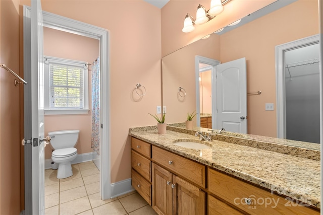 full bath with a shower with shower curtain, vanity, baseboards, tile patterned floors, and toilet