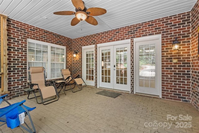 view of patio with french doors and ceiling fan