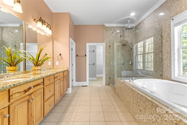 bathroom with a sink, plenty of natural light, a stall shower, and a garden tub