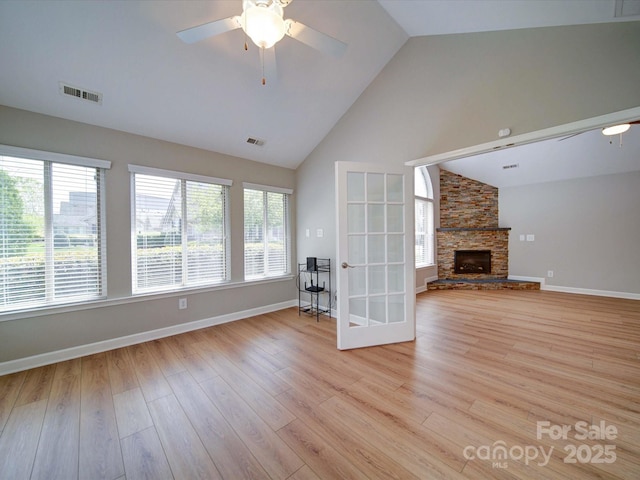 4754 Polo Gate Blvd, Charlotte, NC 28216 - unfurnished living room featuring plenty of natural light, visible vents, ceiling fan, and light wood-type flooring
