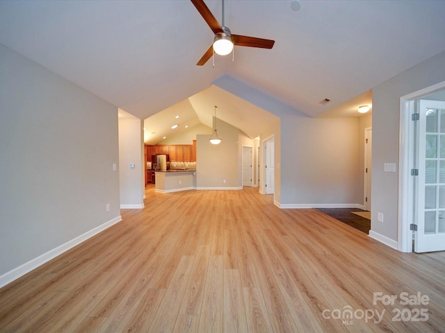 4754 Polo Gate Blvd, Charlotte, NC 28216 - unfurnished living room with light wood-type flooring, baseboards, vaulted ceiling, and ceiling fan