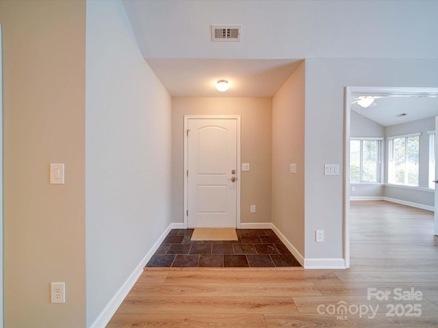 4754 Polo Gate Blvd, Charlotte, NC 28216 - foyer entrance with wood finished floors, baseboards, vaulted ceiling, and visible vents