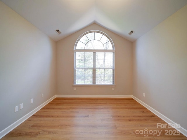 4754 Polo Gate Blvd, Charlotte, NC 28216 - empty room with a wealth of natural light, visible vents, and light wood-style floors