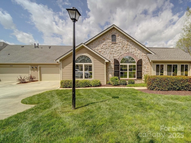 4754 Polo Gate Blvd, Charlotte, NC 28216 - single story home featuring driveway, stone siding, a front lawn, a shingled roof, and a garage
