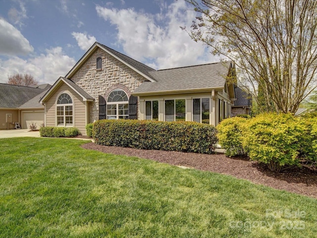 4754 Polo Gate Blvd, Charlotte, NC 28216 - view of front of home featuring an attached garage, stone siding, driveway, a front lawn, and a shingled roof