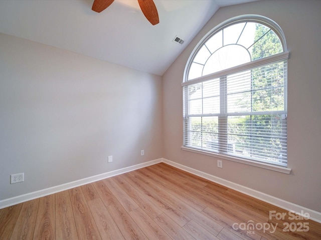 4754 Polo Gate Blvd, Charlotte, NC 28216 - spare room featuring visible vents, light wood finished floors, baseboards, a ceiling fan, and vaulted ceiling