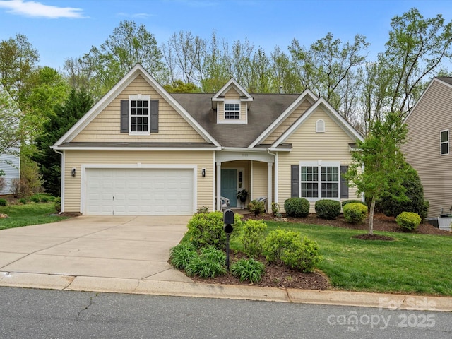 view of front facade with driveway, an attached garage, and a front lawn