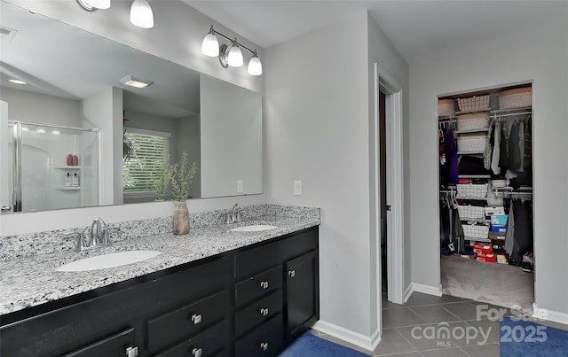 15035 Ockeechobee Ct, Mint Hill, NC 28227 - full bath featuring a spacious closet, baseboards, tile patterned flooring, and a sink