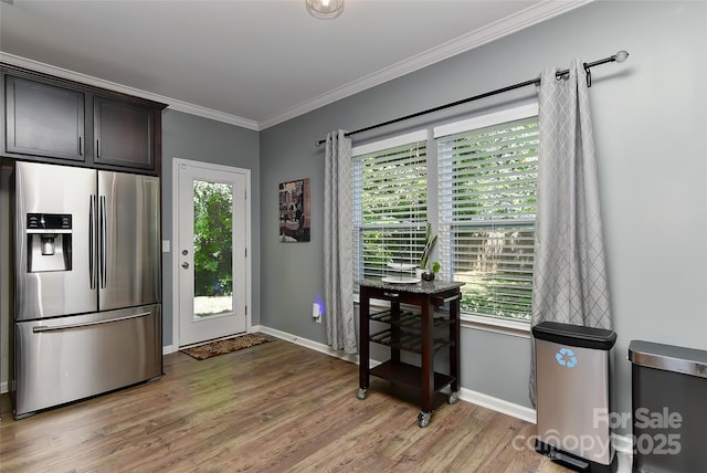15035 Ockeechobee Ct, Mint Hill, NC 28227 - kitchen featuring baseboards, light wood-type flooring, stainless steel refrigerator with ice dispenser, and ornamental molding
