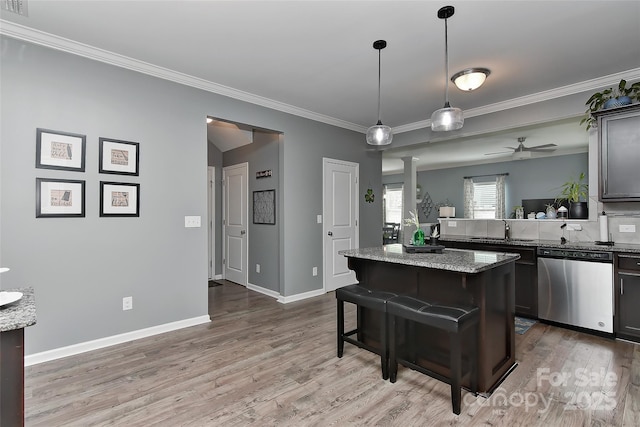 15035 Ockeechobee Ct, Mint Hill, NC 28227 - kitchen featuring wood finished floors, a breakfast bar, ceiling fan, dishwasher, and crown molding