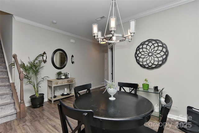 15035 Ockeechobee Ct, Mint Hill, NC 28227 - dining room with ornamental molding, stairs, a notable chandelier, and visible vents