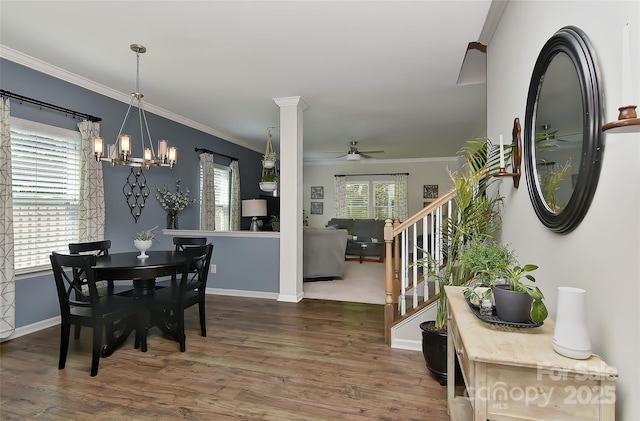 15035 Ockeechobee Ct, Mint Hill, NC 28227 - dining space featuring ornamental molding, stairway, wood finished floors, and ceiling fan with notable chandelier