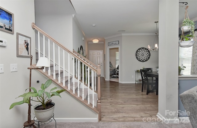 15035 Ockeechobee Ct, Mint Hill, NC 28227 - stairs with an inviting chandelier, wood finished floors, crown molding, and baseboards