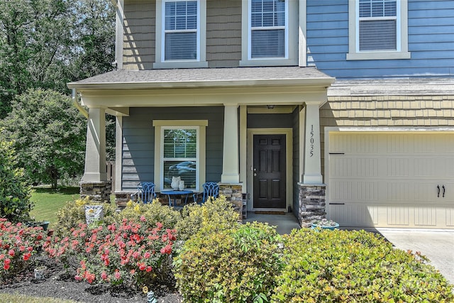 15035 Ockeechobee Ct, Mint Hill, NC 28227 - entrance to property featuring concrete driveway, stone siding, a shingled roof, an attached garage, and a porch
