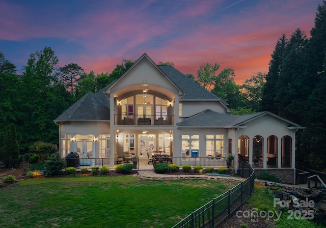 1328 Astoria Pkwy, Sherrills Ford, NC 28609 - back of property at dusk with a balcony, stucco siding, a patio area, french doors, and ceiling fan