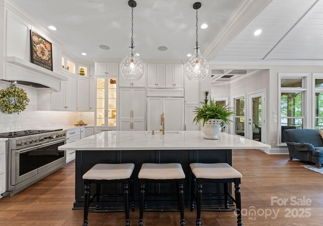 1328 Astoria Pkwy, Sherrills Ford, NC 28609 - kitchen with high end appliances, backsplash, crown molding, white cabinets, and beam ceiling