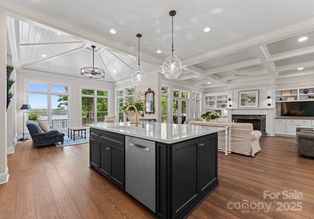 1328 Astoria Pkwy, Sherrills Ford, NC 28609 - kitchen with a sink, stainless steel dishwasher, dark cabinets, open floor plan, and light countertops