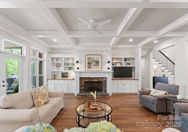 1328 Astoria Pkwy, Sherrills Ford, NC 28609 - living area featuring coffered ceiling, ceiling fan, wood finished floors, stairway, and beamed ceiling