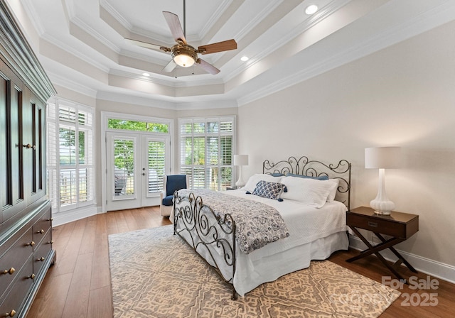 1328 Astoria Pkwy, Sherrills Ford, NC 28609 - bedroom with access to outside, wood finished floors, a tray ceiling, a ceiling fan, and ornamental molding