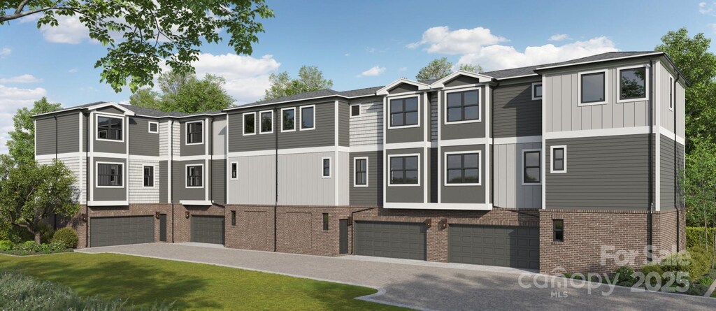 8929 Sharonbrook Dr, Charlotte, NC 28210 - townhome / multi-family property with board and batten siding, an attached garage, brick siding, and a residential view