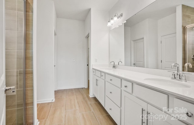 13756 Roderick Dr Unit 176, Huntersville, NC 28078 - full bath with tiled shower, double vanity, a sink, and baseboards