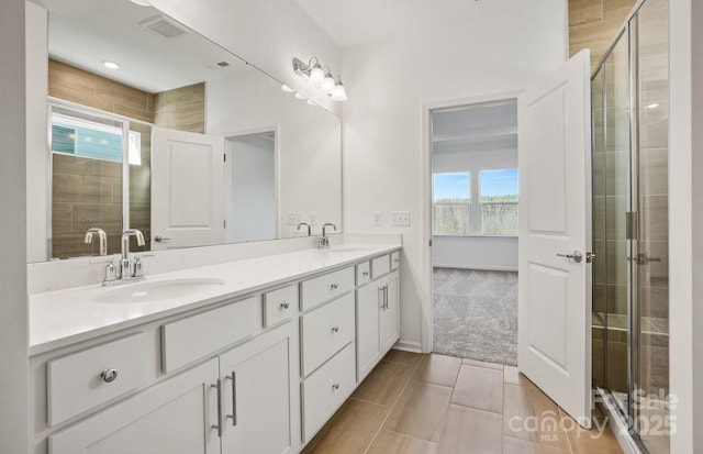 13756 Roderick Dr Unit 176, Huntersville, NC 28078 - bathroom with a shower stall, double vanity, and a sink
