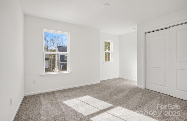 13756 Roderick Dr Unit 176, Huntersville, NC 28078 - unfurnished bedroom featuring baseboards, multiple windows, and carpet floors