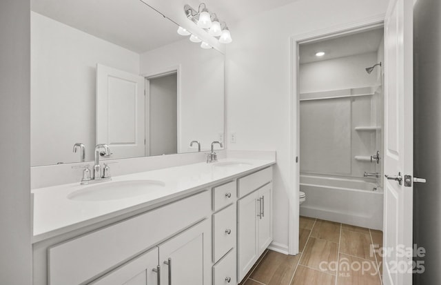 13756 Roderick Dr Unit 176, Huntersville, NC 28078 - bathroom featuring a sink, toilet, double vanity, and shower / washtub combination
