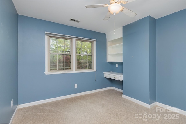 unfurnished room featuring light carpet, baseboards, ceiling fan, and visible vents