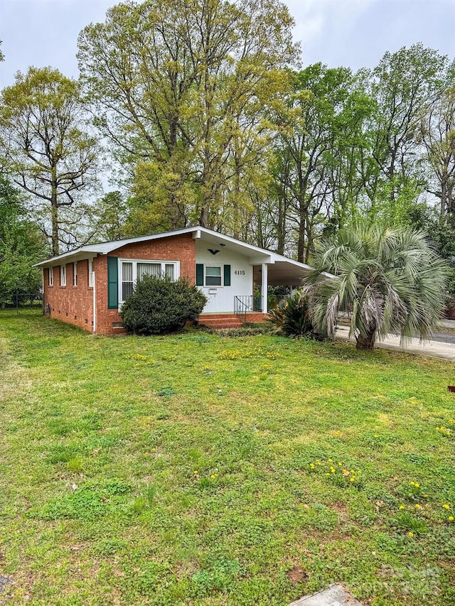 6115 Amberly Ln, Charlotte, NC 28213 - view of front of home featuring a front lawn and brick siding