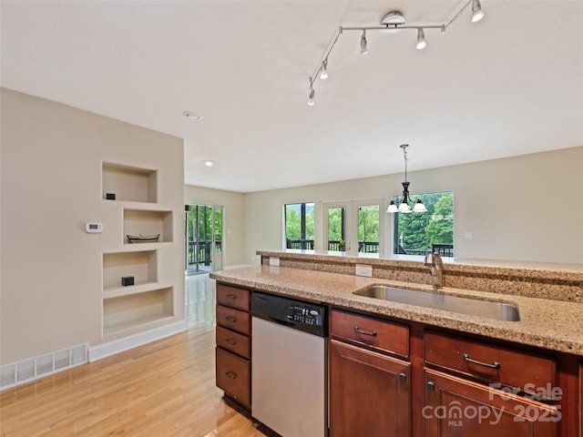 234 Bird Creek Dr, Waynesville, NC 28786 - kitchen featuring dishwasher, a sink, built in shelves, light wood-style floors, and decorative light fixtures