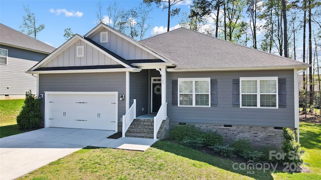 view of front facade featuring board and batten siding, crawl space, a front lawn, an attached garage, and driveway