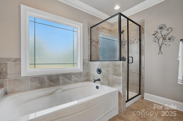 full bathroom with a bath, a wealth of natural light, a stall shower, and ornamental molding