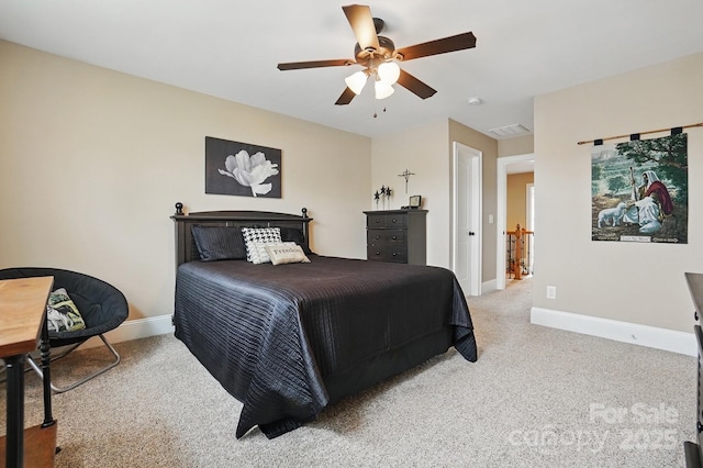 carpeted bedroom featuring visible vents, baseboards, and ceiling fan