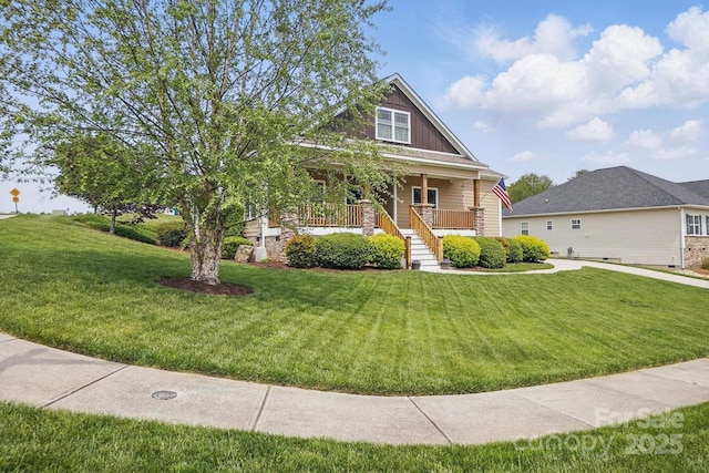 craftsman inspired home featuring a porch, stairs, and a front yard