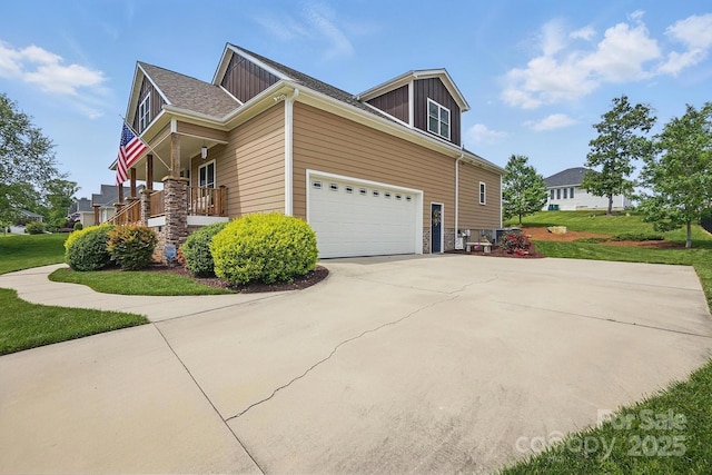 view of property exterior featuring driveway, covered porch, a garage, board and batten siding, and a yard