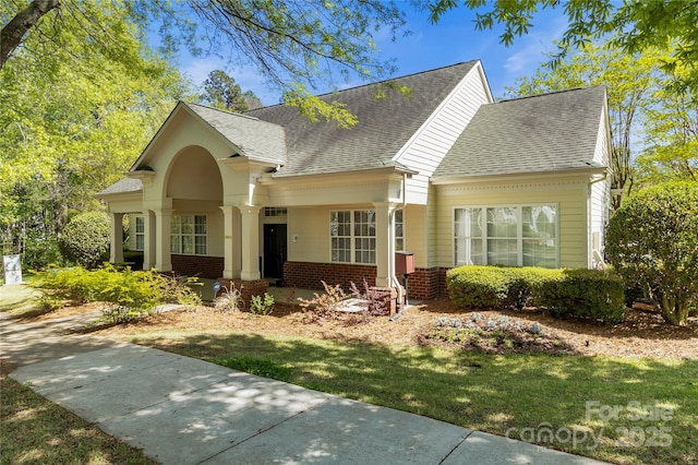 18838 Oakhurst Blvd, Cornelius, NC 28031 - view of front of house featuring brick siding and a shingled roof