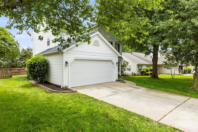 garage with concrete driveway