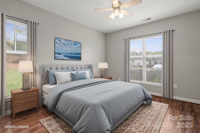 10720 Hill Point Ct, Charlotte, NC 28262 - bedroom with visible vents, baseboards, ceiling fan, and wood finished floors