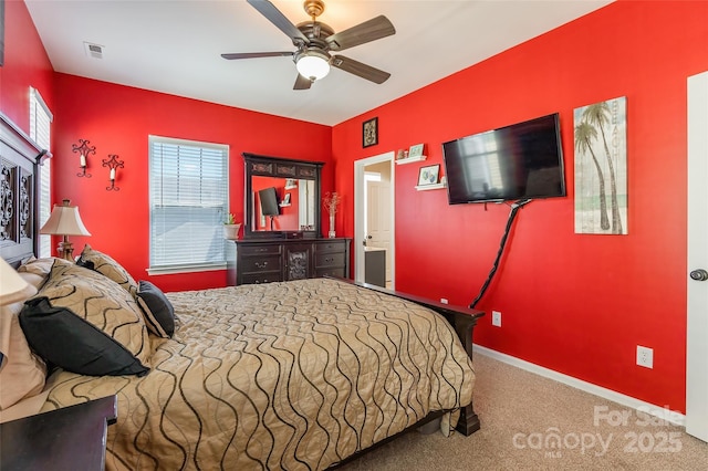 bedroom with visible vents, baseboards, a ceiling fan, and carpet floors