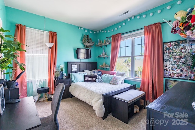 bedroom featuring visible vents and carpet flooring