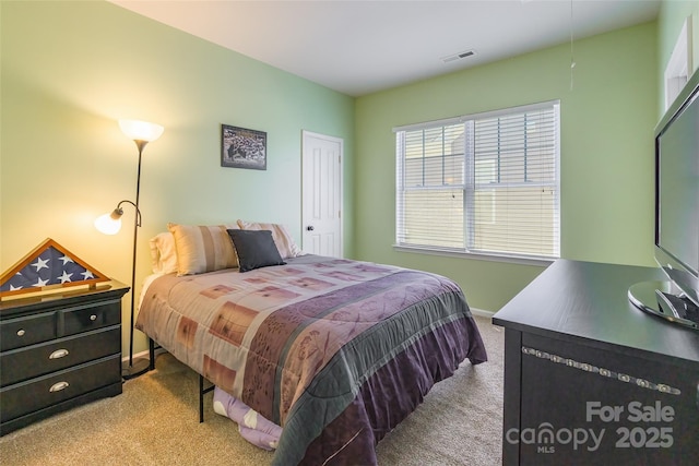 bedroom featuring carpet flooring, baseboards, and visible vents