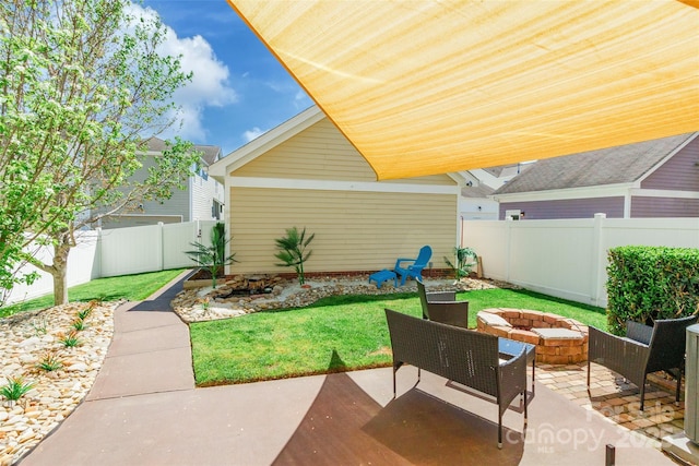 view of patio / terrace featuring an outdoor fire pit and a fenced backyard