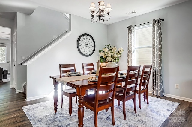 517 Bertram Rd, Fort Mill, SC 29708 - dining area featuring baseboards, an inviting chandelier, stairs, visible vents, and wood finished floors