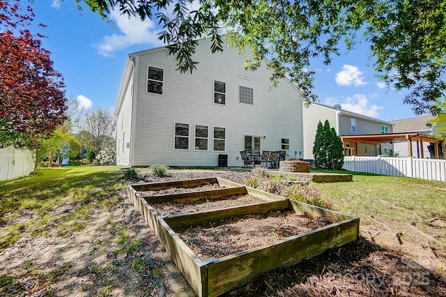 517 Bertram Rd, Fort Mill, SC 29708 - back of property featuring a yard, a garden, and fence