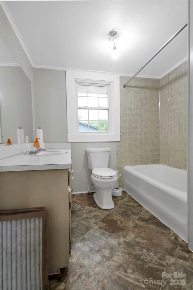 bathroom with toilet, vanity, radiator heating unit, washtub / shower combination, and ornamental molding