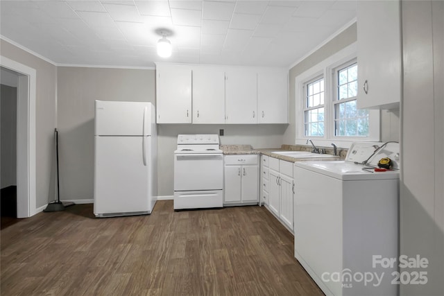 kitchen featuring light countertops, a sink, washer / dryer, white appliances, and white cabinets