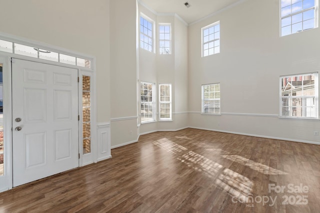 15814 Herring Gull Way, Charlotte, NC 28278 - entrance foyer featuring a wealth of natural light, crown molding, wood finished floors, and baseboards
